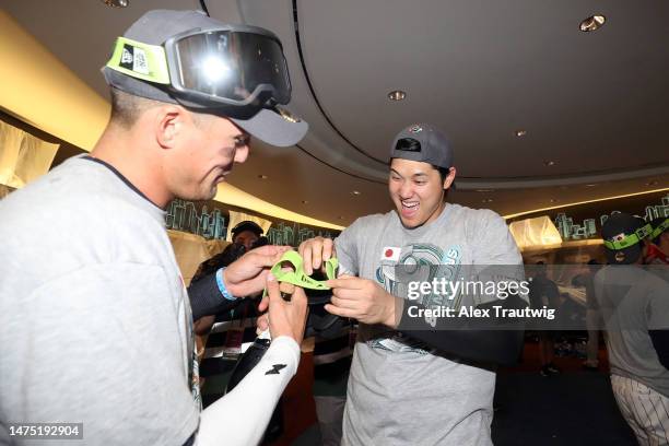 Shohei Ohtani and Lars Nootbaar of Team Japan celebrate in the clubhouse after defeating Team USA in the World Baseball Classic Championship 3-2 at...