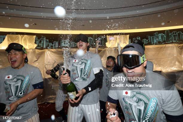 Kazuma Okamoto, Shohei Ohtani, and Munetaka Murakami of Team Japan celebrate in the clubhouse after defeating Team USA in the World Baseball Classic...