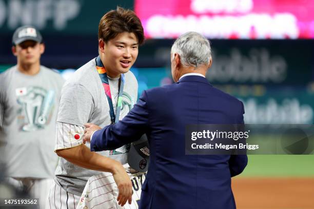 Munetaka Murakami of Team Japan is awarded a medal from Commissioner of Baseball Rob Manfred after defeating Team USA 3-2 in the World Baseball...