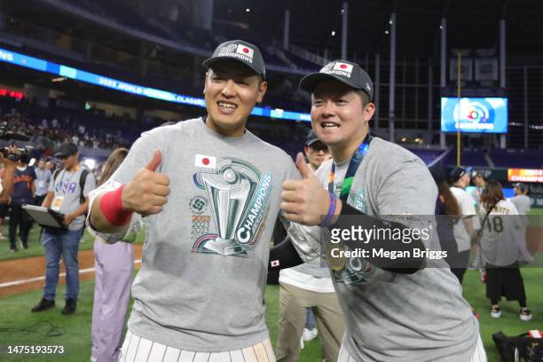 Kazuma Okamoto and Shugo Maki of Team Japan celebrate after defeating Team USA in the World Baseball Classic Championship at loanDepot park on March...