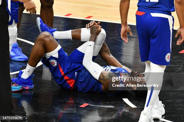 Paul George of the Los Angeles Clippers suffers an apparent knee injury during a basketball game against the Oklahoma City Thunder at Crypto.com...