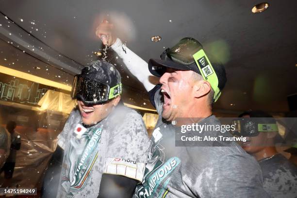 Shohei Ohtani and Lars Nootbaar of Team Japan celebrate in the clubhouse after defeating Team USA in the World Baseball Classic Championship 3-2 at...