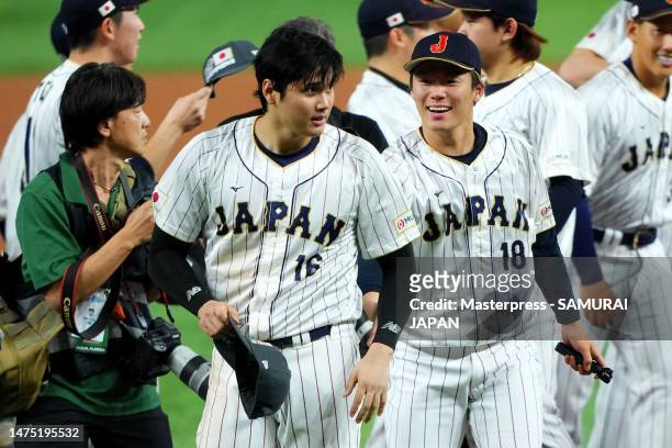 Shohei Ohtani and Yoshinobu Yamamoto of Team Japan celebrate after defeating Team USA 3-2 in the World Baseball Classic Championship at loanDepot...