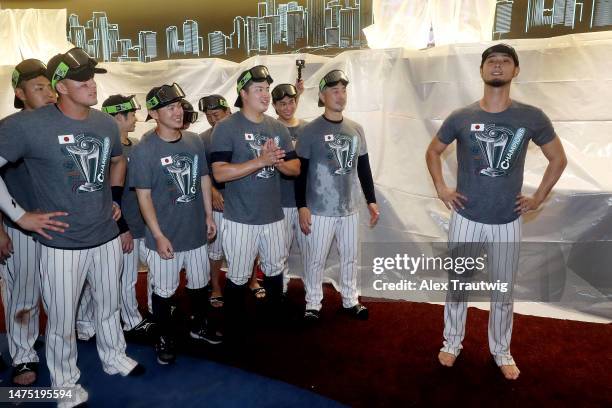 Yu Darvish of Team Japan speaks to his teammates in the clubhouse after defeating Team USA in the World Baseball Classic Championship 3-2 at...