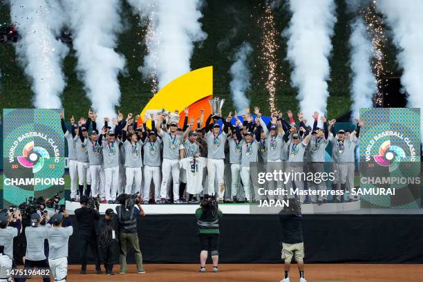 Shohei Ohtani of Team Japan lifts the trophy at the award ceremony after defeating Team USA 3-2 following the World Baseball Classic Championship at...