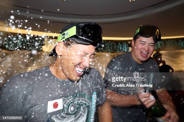 Masataka Yoshida and Munetaka Murakami of Team Japan celebrate in the clubhouse after defeating Team USA in the World Baseball Classic Championship...