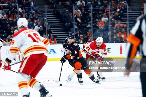 Trevor Zegras of the Anaheim Ducks skates the puck against the Calgary Flames in the second period at Honda Center on March 21, 2023 in Anaheim,...
