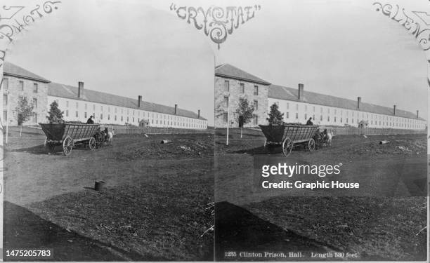 Stereoscopic image showing a hore-drawn cart passing the 530-foot long prison hall at Clinton Prison , a maximum security state prison in Dannemora,...