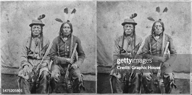 Stereoscopic image showing Unc-pa-che-na Sioux warriors posing with repeating rifles, possibly in Morrow's studios in Yankton, South Dakota, circa...