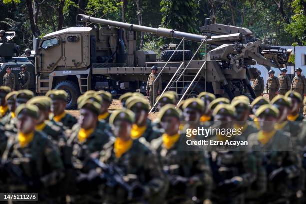 Philippine troops stand in formation during the 126th founding anniversary of the Philippine Army at Fort Bonifacio on March 22, 2023 in Taguig,...