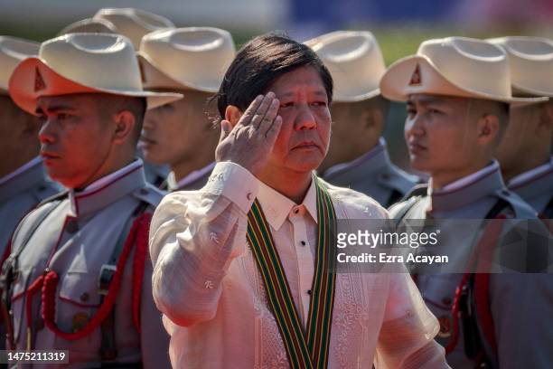 Philippine President Ferdinand Marcos Jr. Reviews an honor guard during the 126th founding anniversary of the Philippine Army at Fort Bonifacio on...