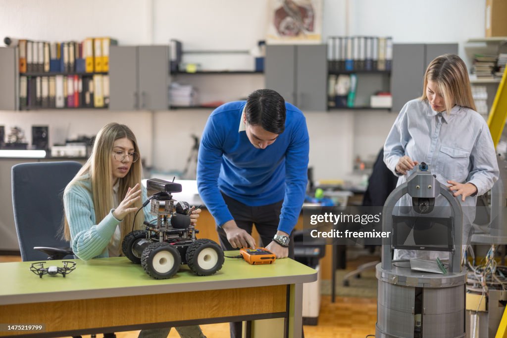 Robotics engineering students working on their new project in laboratory