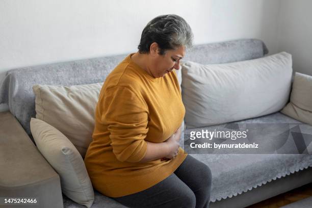 woman feels pain - injecting stomach stock pictures, royalty-free photos & images