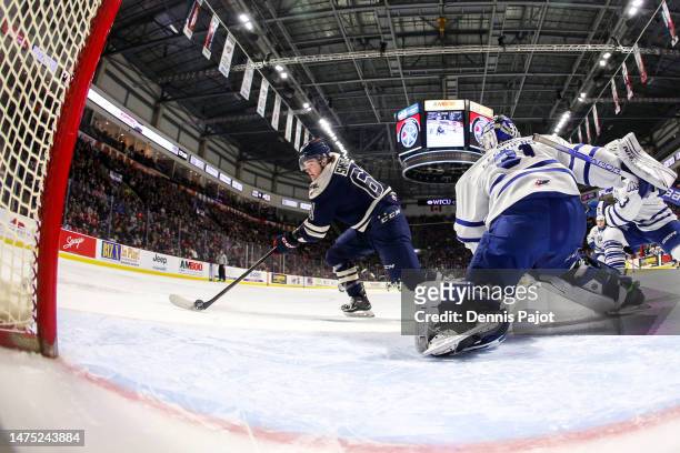 Forward Colton Smith of the Windsor Spitfires scores his goal against goaltender Ryerson Leenders of the Mississauga Steelheads at WFCU Centre on...