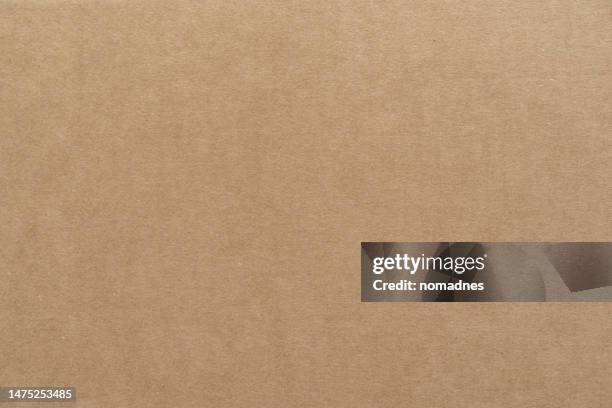 cardboard paper texture. packaging box natural color texture. - cardboard box photos et images de collection