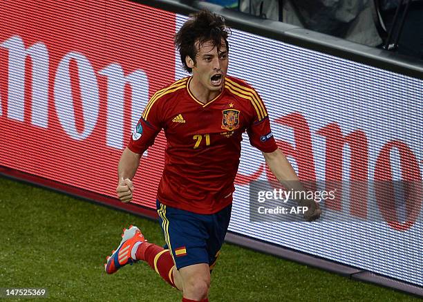 Spanish midfielder David Silva celebrates after scoring a goal during the Euro 2012 football championships final match Spain vs Italy on July 1, 2012...