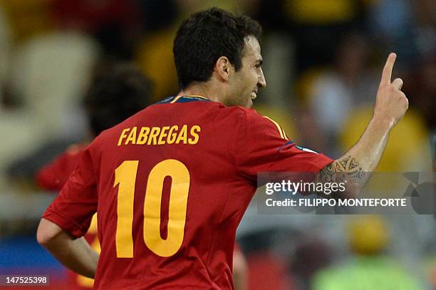 Spanish midfielder Cesc Fabregas celebrates after scoring during the Euro 2012 football championships final match Spain vs Italy on July 1, 2012 at...
