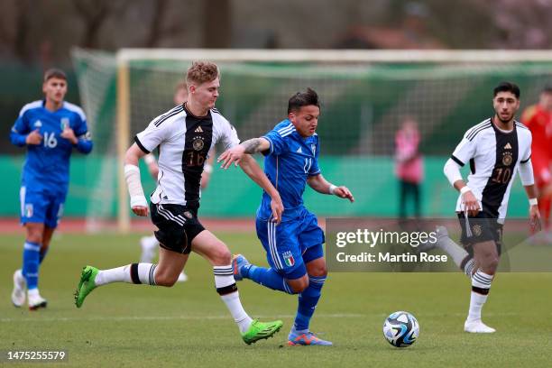 Tom Rothe of Germany U19 challenges Luca D'Andrea of Italy U19 during the UEFA European Under-19 Championship Malta 2023 qualifying match between...