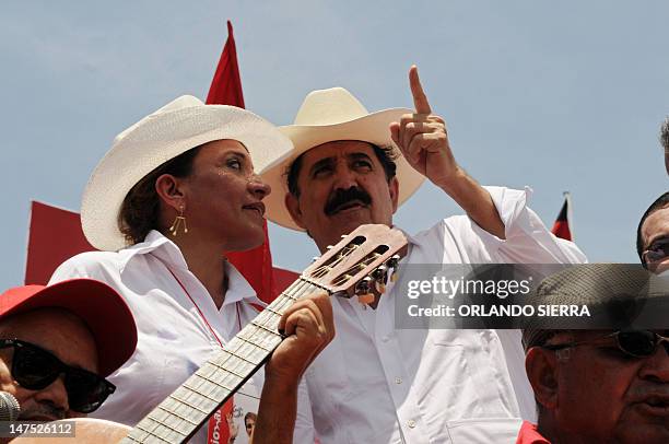 Xiomara Castro , looks at her husband former President of Honduras and coordinator of the National Front of Popular Resistance , Manuel Zelaya...