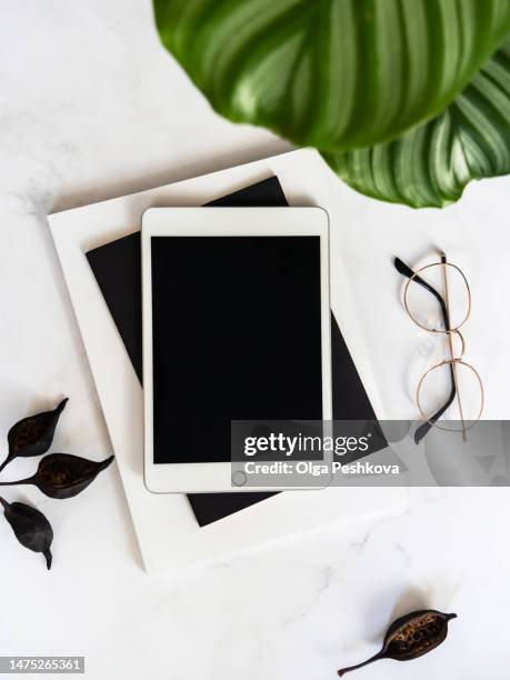 flat lay of white tablet with screen mock up - graphics tablet stock pictures, royalty-free photos & images