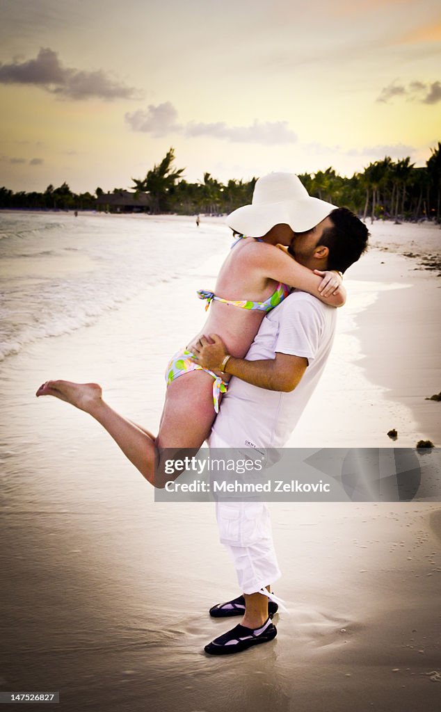 Couple in love kissing on beach