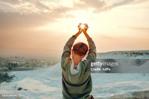 boy making heart by hands - pamukkale stock pictures, royalty-free photos & images