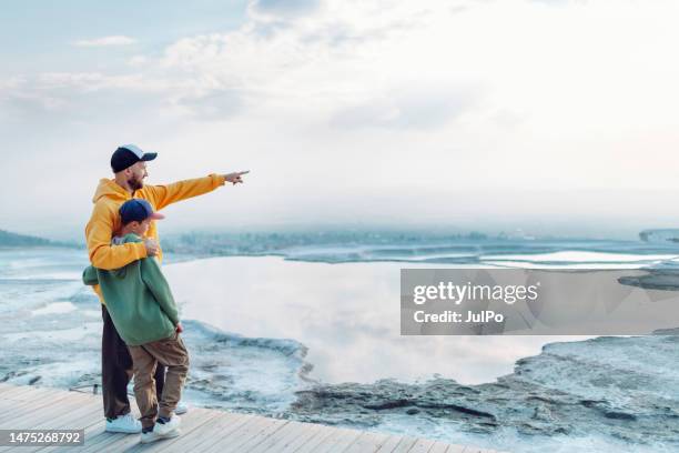 father and son looking at view at pamukkale - grand 8 stock pictures, royalty-free photos & images