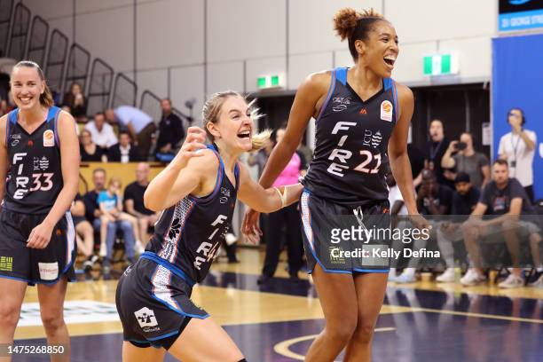Karlie Samuelson of the Fire and Tianna Hawkins of the Fire react on the buzzer during games two of the WNBL Grand Final series between Southside...