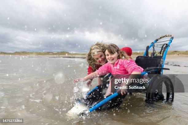 making a big splash with mummy - children playing outside stock pictures, royalty-free photos & images