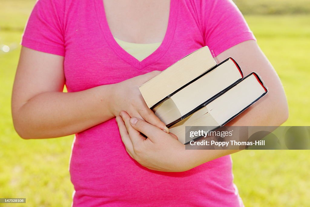 Girl holding books