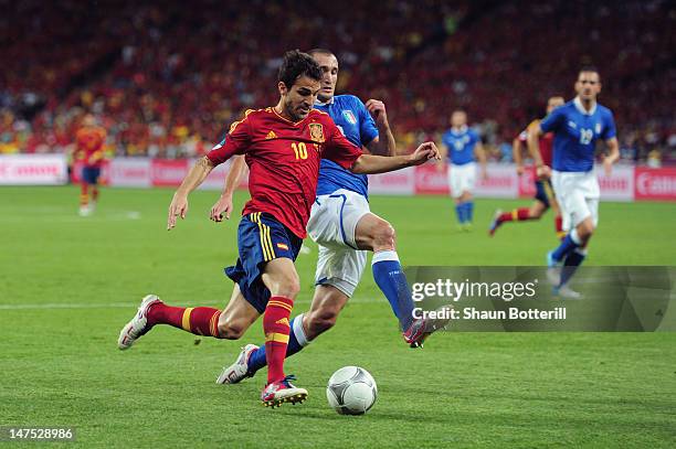 Cesc Fabregas of Spain battles for the ball with Giorgio Chiellini of Italy during the UEFA EURO 2012 final match between Spain and Italy at the...