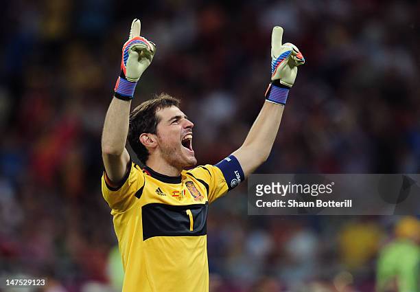 Iker Casillas of Spain celebrates after his team-mate Fernando Torres scored their third goal during the UEFA EURO 2012 final match between Spain and...