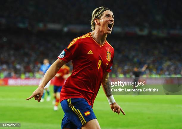 Fernando Torres of Spain celebrates scoring his side's third goal past Gianluigi Buffon of Italy during the UEFA EURO 2012 final match between Spain...