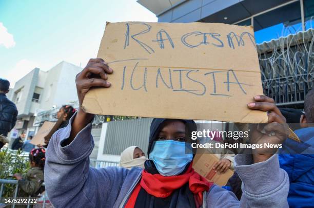 Tunis - Tunisia, 21 March 2023: A person holding a sign during the Protest in front of UNHCR Headquarter in the capital Tunis Tunisia, demanding help...