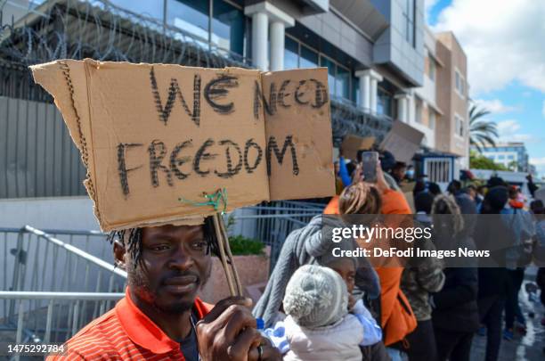 Tunis - Tunisia, 21 March 2023: A person holding a sign during the Protest in front of UNHCR Headquarter in the capital Tunis Tunisia, demanding help...