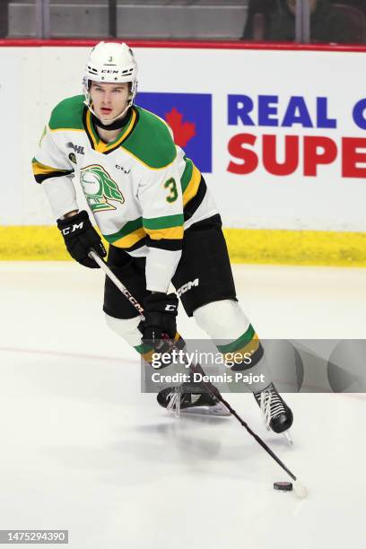 Defenceman Sam Dickinson of the London Knights moves the puck against the Windsor Spitfires at the WFCU Centre on March 2, 2023 in Windsor, Ontario,...