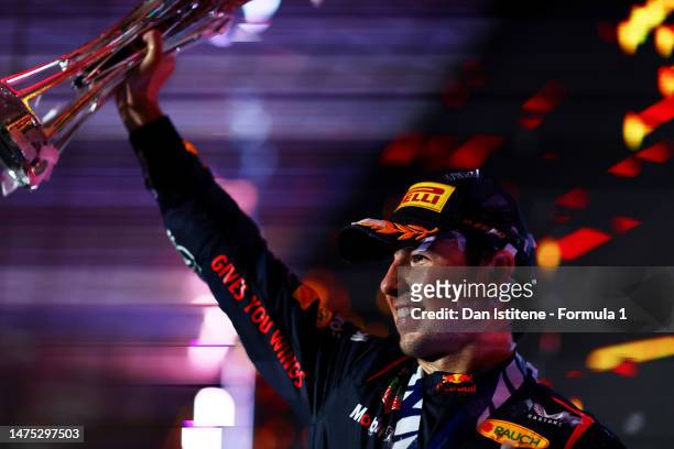 Race winner Sergio Perez of Mexico and Oracle Red Bull Racing celebrates on the podium during the F1 Grand Prix of Saudi Arabia at Jeddah Corniche...