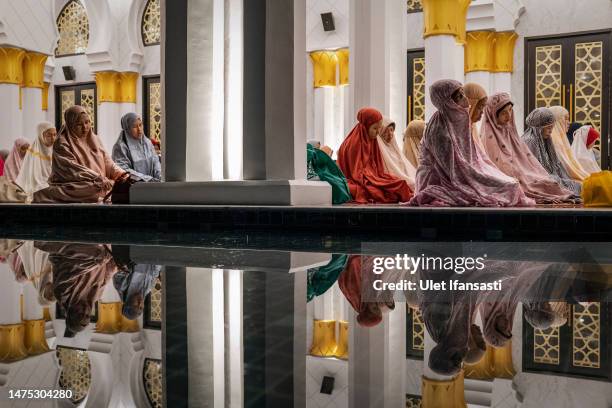 Indonesian Muslims perform Tarawih prayers to mark the start of the holy month of Ramadan at the Sheikh Zayed Solo Grand Mosque on March 22, 2023 in...