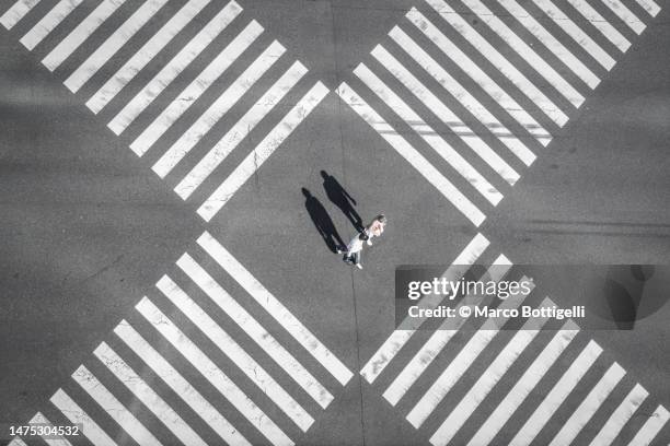 people walking on pedestrian crossing in ginza, tokyo - incrocio stradale foto e immagini stock