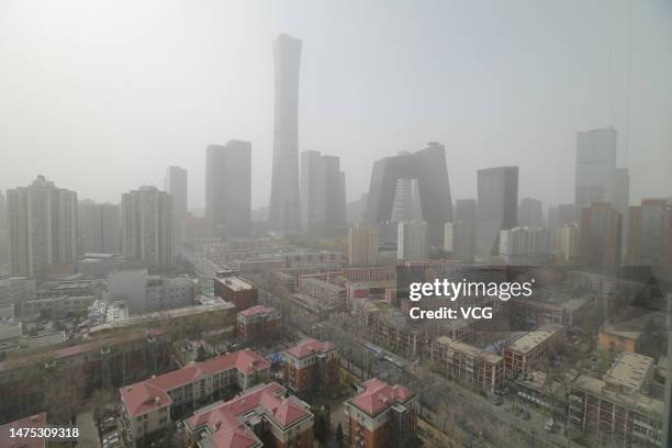 Skyscrapers stand in the central business district during a sandstorm on March 22, 2023 in Beijing, China.