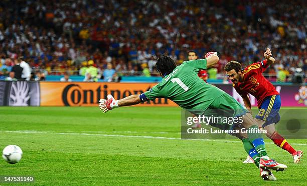 Juan Mata of Spain scores his team's fourth goal past Gianluigi Buffon of Italy during the UEFA EURO 2012 final match between Spain and Italy at the...