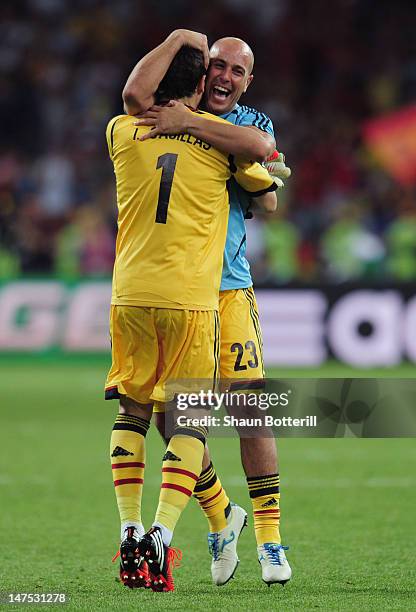 Iker Casillas and Pepe Reina of Spain celebrate their victory after the UEFA EURO 2012 final match between Spain and Italy at the Olympic Stadium on...