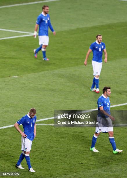 Ignazio Abate and Andrea Barzagli of Italy show their dejection after the UEFA EURO 2012 final match between Spain and Italy at the Olympic Stadium...