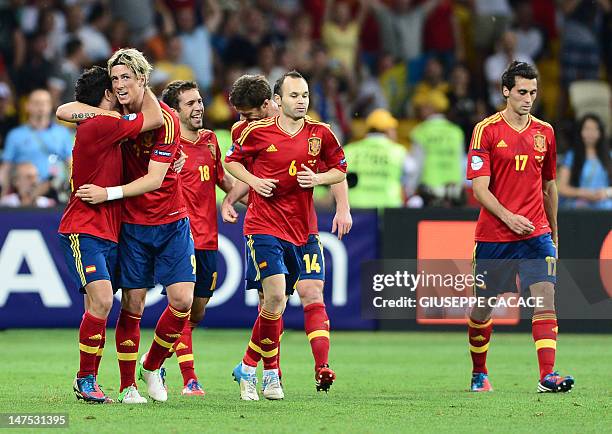 Spanish players celebrate after scoring a goal during the Euro 2012 football championships final match Spain vs Italy on July 1, 2012 at the Olympic...