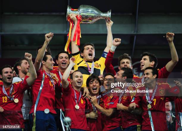 Captain Iker Casillas of Spain lifts the trophy after victory during the UEFA EURO 2012 final match between Spain and Italy at the Olympic Stadium on...