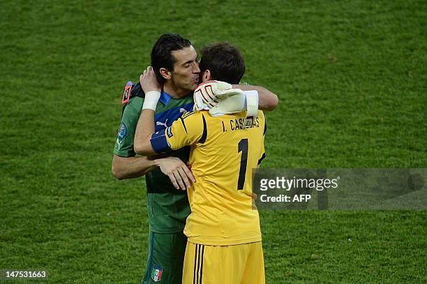 Italian goalkeeper Gianluigi Buffon congratulates Spanish goalkeeper Iker Casillas during the Euro 2012 football championships final match Spain vs...