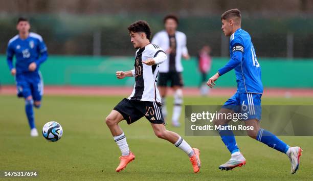 Mika Baur of Germany U19 challenges Giacomo Faticanti of Italy U19 during the UEFA European Under-19 Championship Malta 2023 qualifying match between...