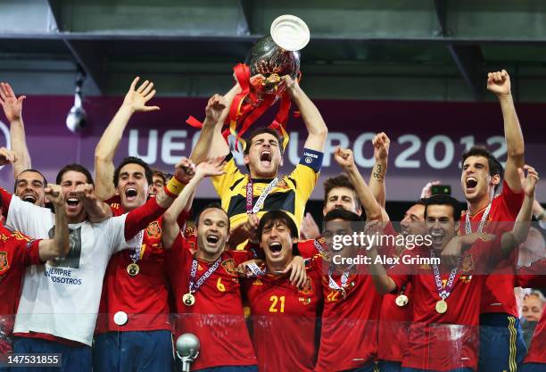 Iker Casillas of Spain lifts the trophy as he celebrates with team-mates following victory in the UEFA EURO 2012 final match between Spain and Italy...