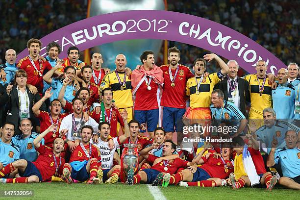 The Spanish team celebrate with the trophy following the UEFA EURO 2012 final match between Spain and Italy at the Olympic Stadium on July 1, 2012 in...