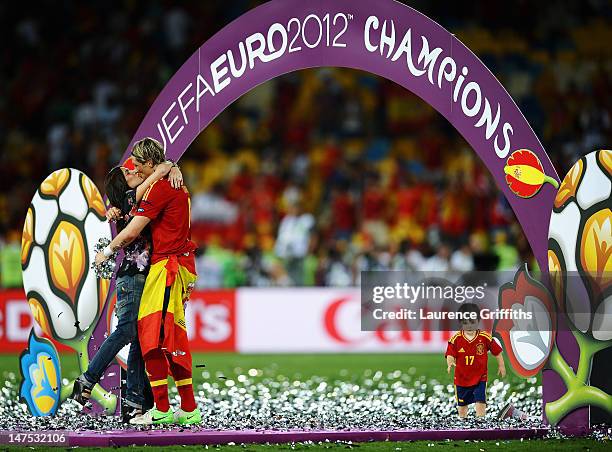 Fernando Torres of Spain kisses his wife Olalla Dominguez on the pitch following victory in the UEFA EURO 2012 final match between Spain and Italy at...